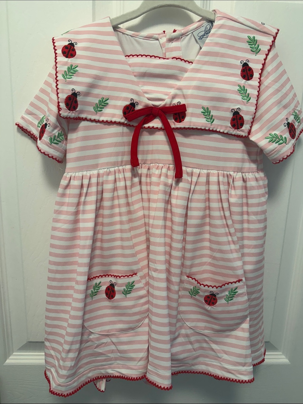 Girls Pink Striped Sailor Dress with Red Bow and Ladybug Motif